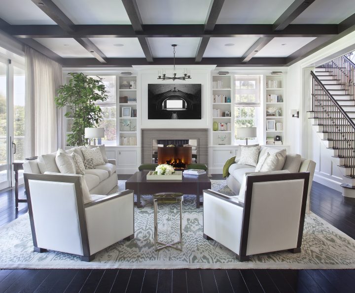 A living room designed by Adam Hunter with two club chairs and two sofas.