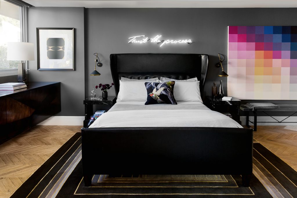 Adam Hunter designed bedroom with black leather bed.