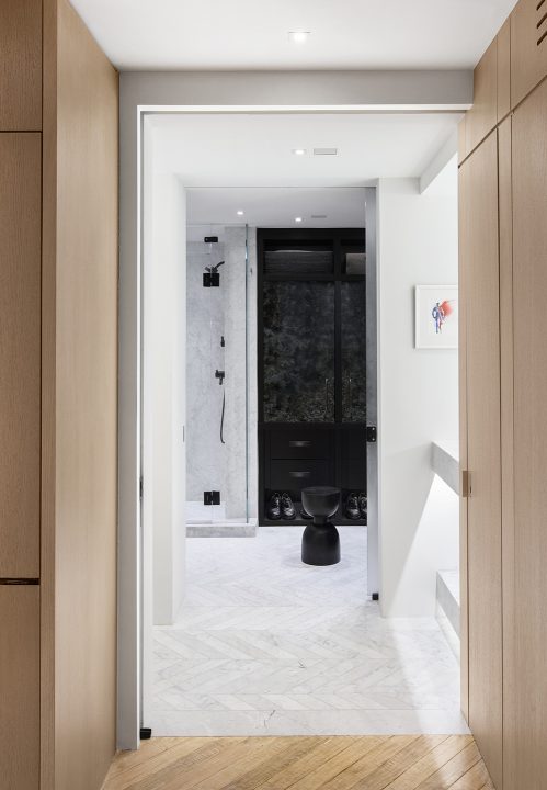 Adam Hunter designed bathroom with walk in closet.