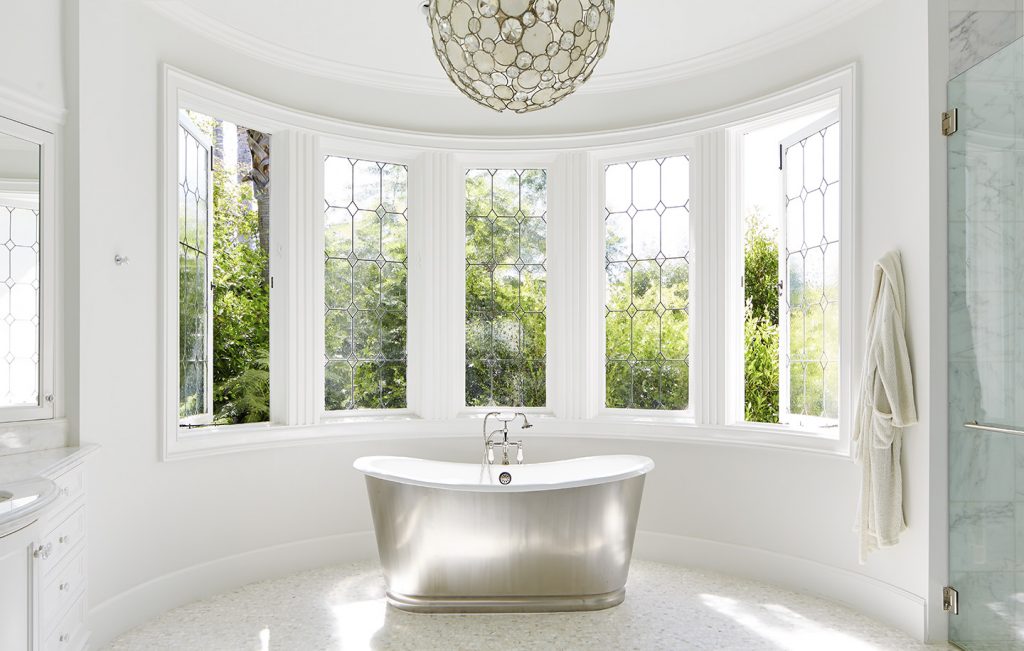 Adam Hunter designed bathroom in Brentwood park with a chandelier and stand alone tub.
