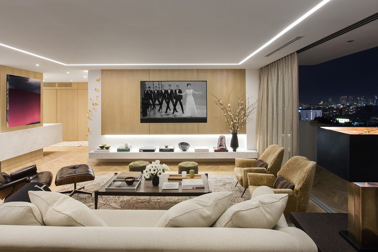 Adam Hunter designed home with large tv.