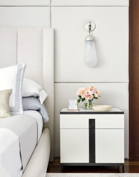Adam Hunter designed bedroom with a detail shot of the nightstand and sconce above.