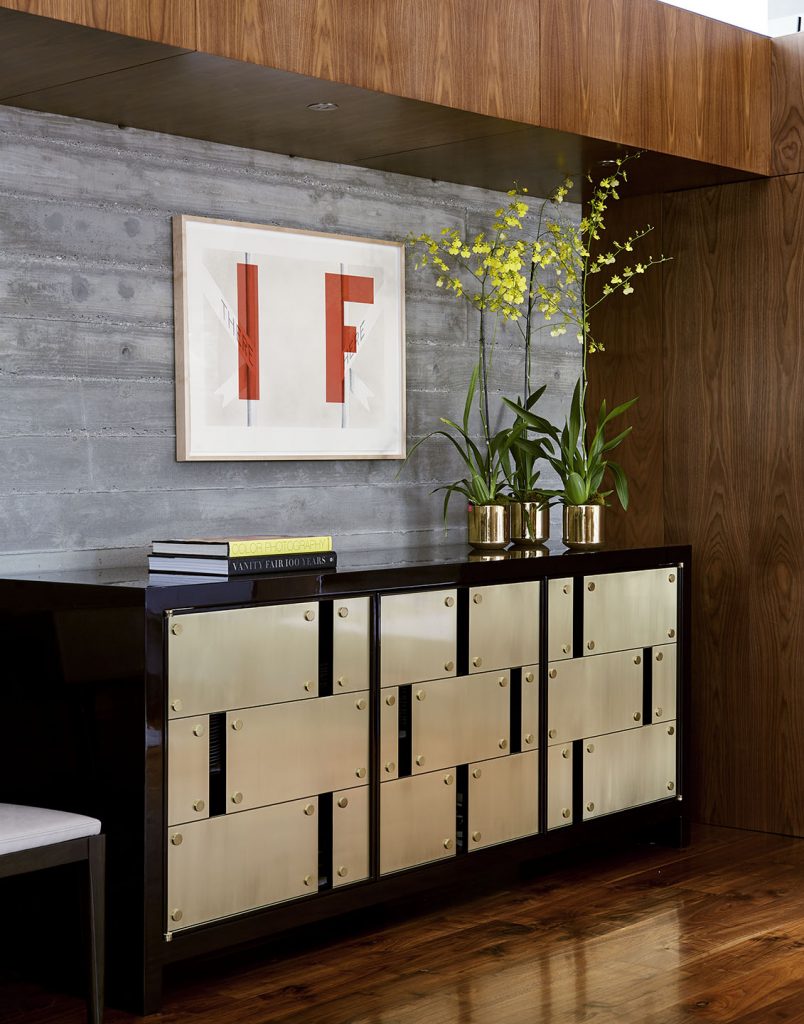 Adam Hunter designed space in a dining room with an Ed Ruscha piece.