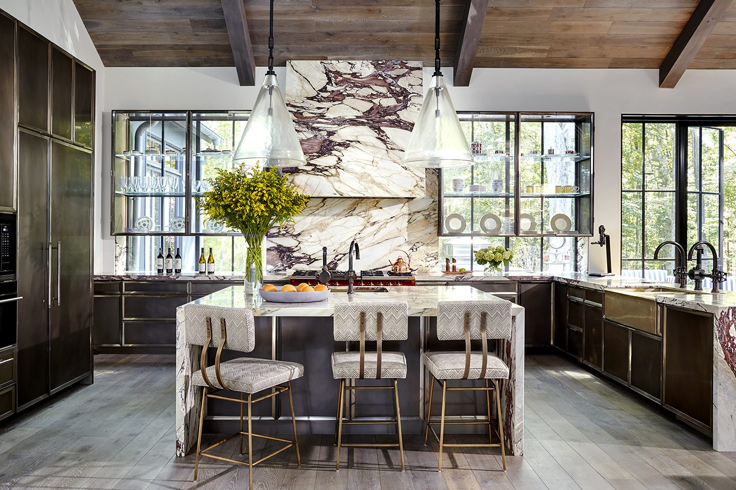 Adam Hunter Designed kitchen with red and white marble and metal cabinets.