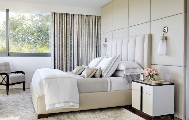 Adam Hunter designed master bedroom with light color leather and light colored drapery.