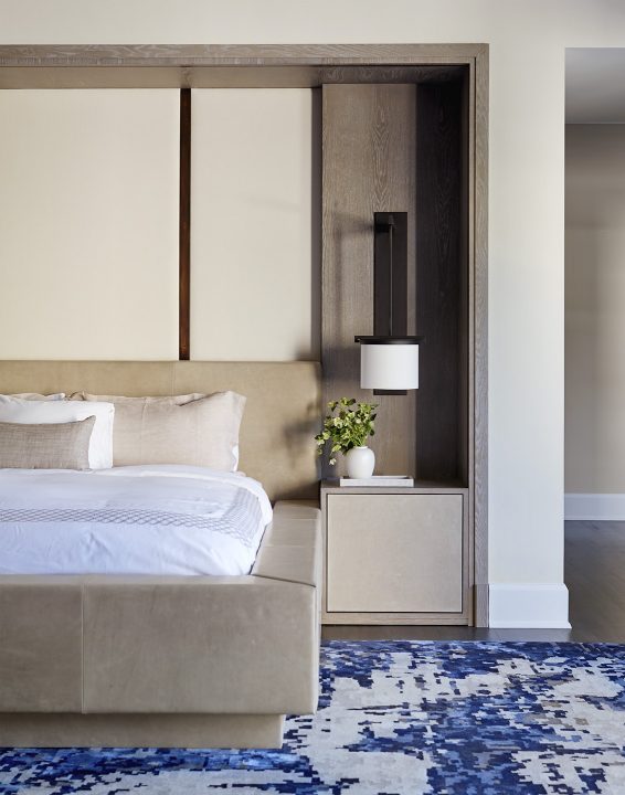 Adam Hunter designed built-in bed with sconces and a blue rug.