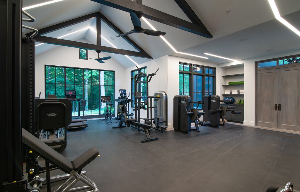 Adam Hunter designed gym with led lighting and lots of gym equpitment